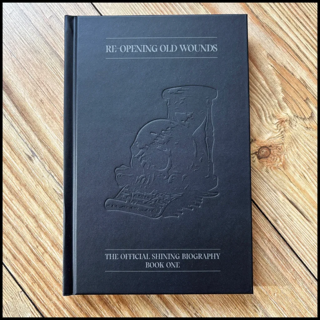 RE-OPENING OLD WOUNDS (The Official Shining Biography) (Book)